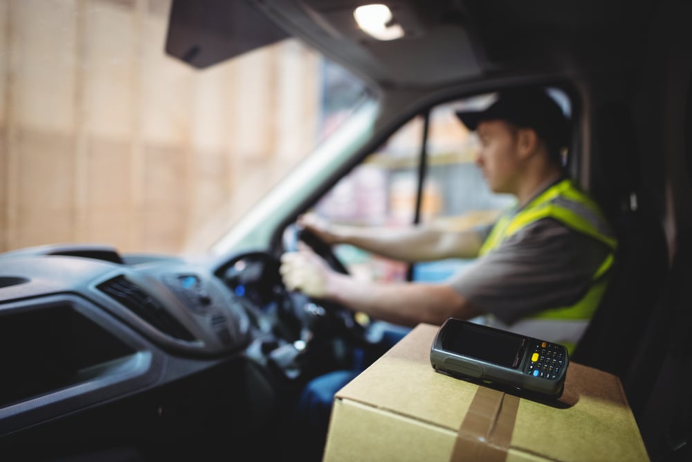 Delivery driver driving van