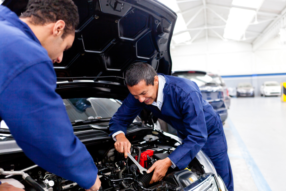 Mechanics working on a car